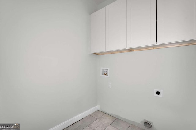 2005 Washington St, Savannah, GA 31406 - washroom with electric dryer hookup, cabinet space, hookup for a washing machine, baseboards, and light tile patterned floors