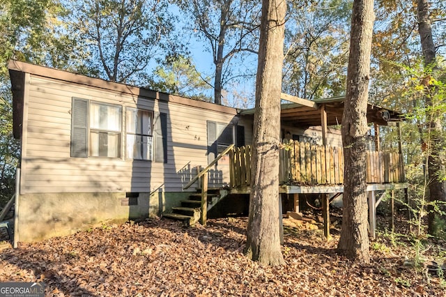 exterior space featuring a wooden deck