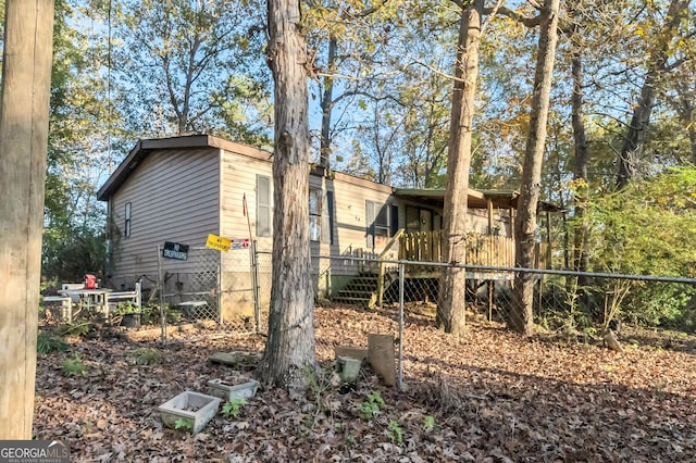 view of side of home featuring a deck