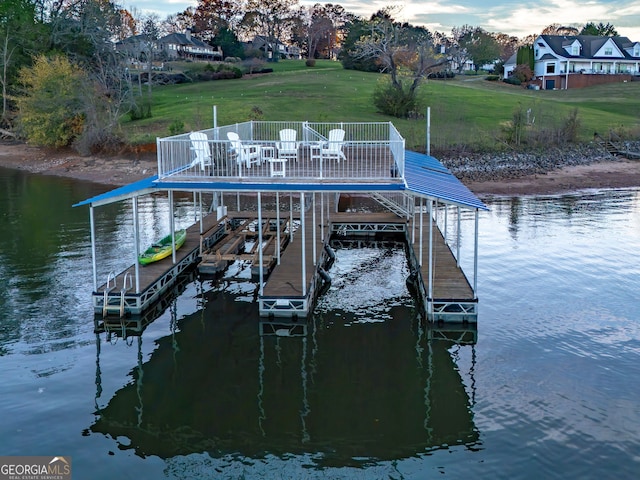 dock area with a water view