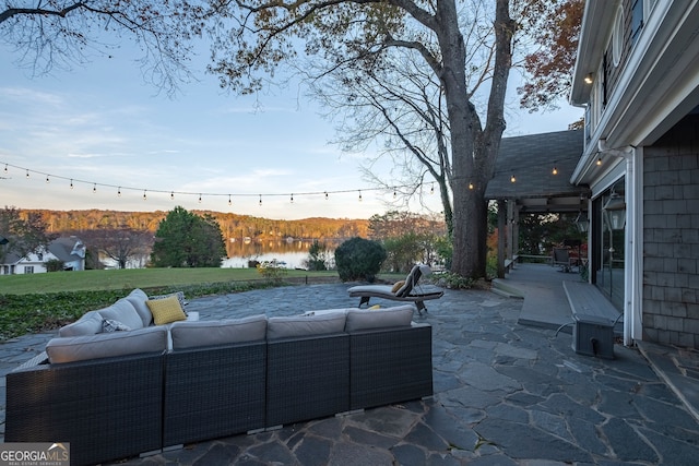 view of patio / terrace featuring outdoor lounge area and a water view