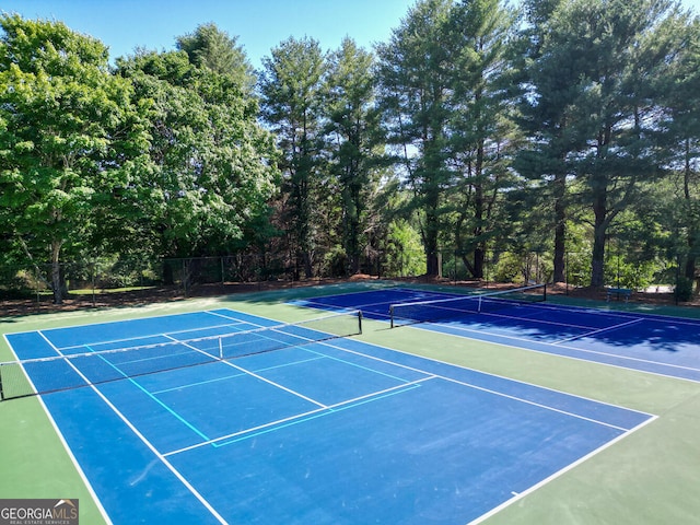 view of sport court with basketball hoop