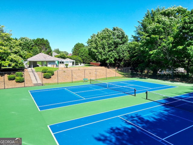 view of tennis court featuring basketball court