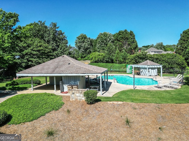 view of swimming pool featuring a patio