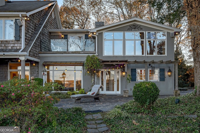 rear view of property featuring a patio area