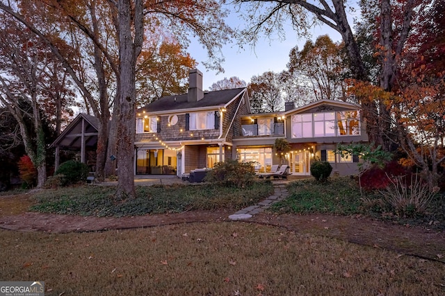 back of house with a patio area