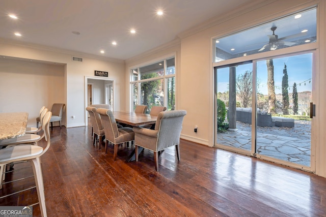 dining room with ceiling fan, dark hardwood / wood-style flooring, and crown molding