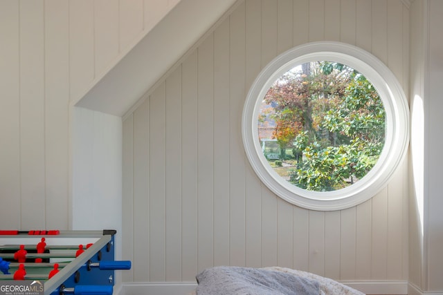 interior space featuring wooden walls