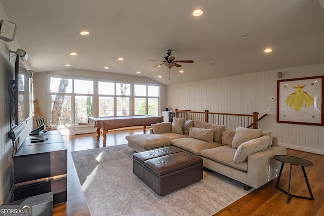 living room featuring light wood-type flooring, vaulted ceiling, ceiling fan, and pool table