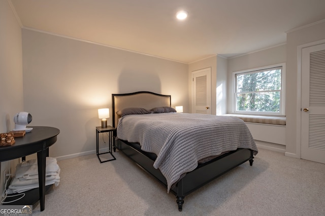 carpeted bedroom with ornamental molding