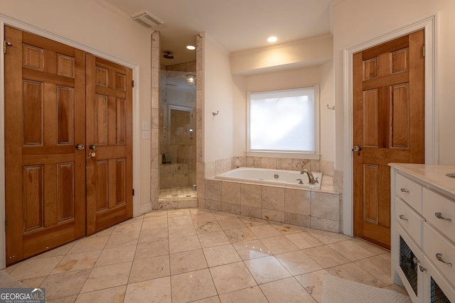 bathroom featuring tile patterned floors, vanity, and separate shower and tub