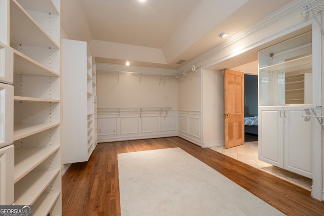 spacious closet with light hardwood / wood-style floors