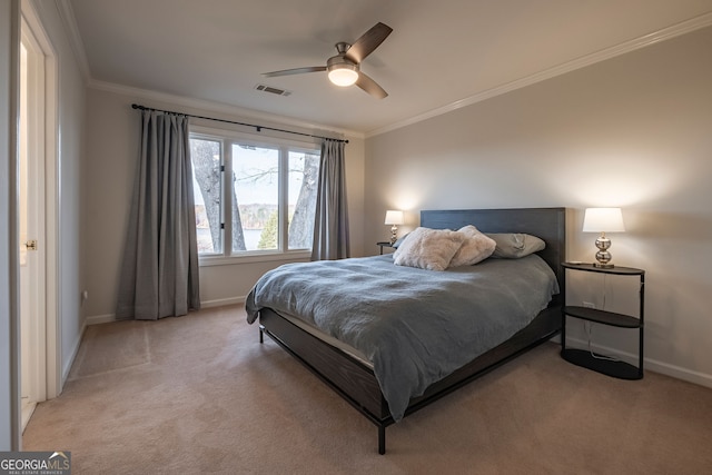 carpeted bedroom featuring ceiling fan and ornamental molding