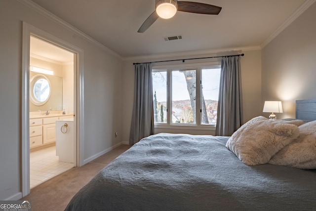 bedroom featuring light colored carpet, ceiling fan, crown molding, sink, and connected bathroom