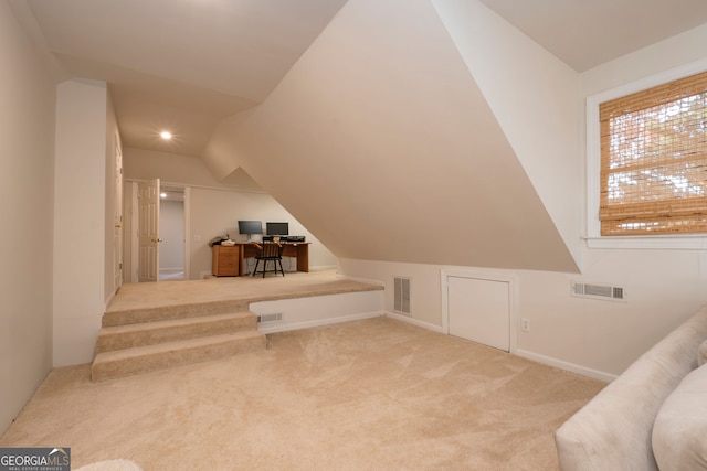 additional living space featuring carpet and lofted ceiling