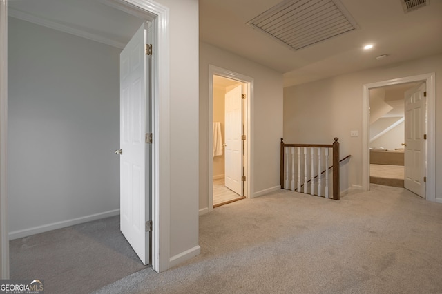 hallway with light carpet