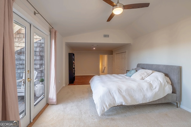 carpeted bedroom with ceiling fan, lofted ceiling, and access to outside