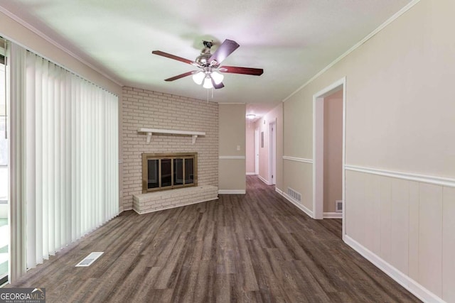 unfurnished living room featuring dark hardwood / wood-style flooring, a fireplace, and a wealth of natural light