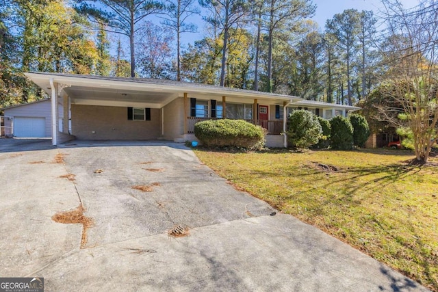 single story home with covered porch and a front yard