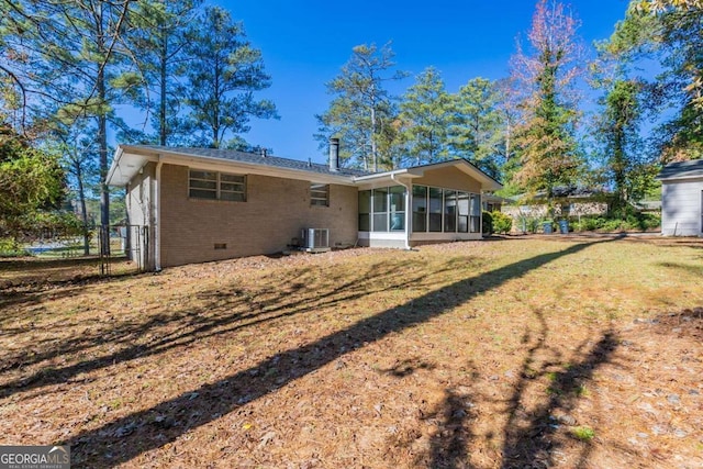 back of property featuring a sunroom and cooling unit