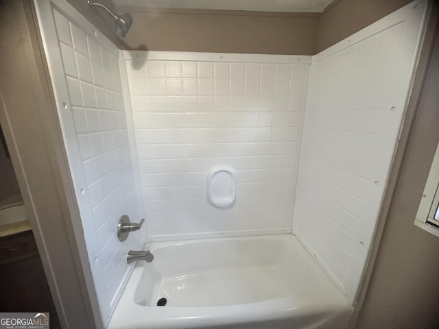 bathroom with washtub / shower combination