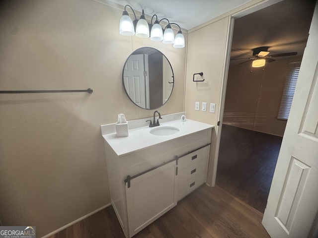 bathroom with vanity, ceiling fan, and wood-type flooring