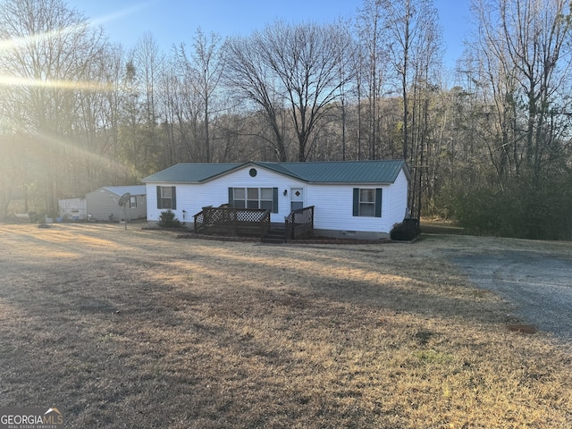 ranch-style home with a front yard