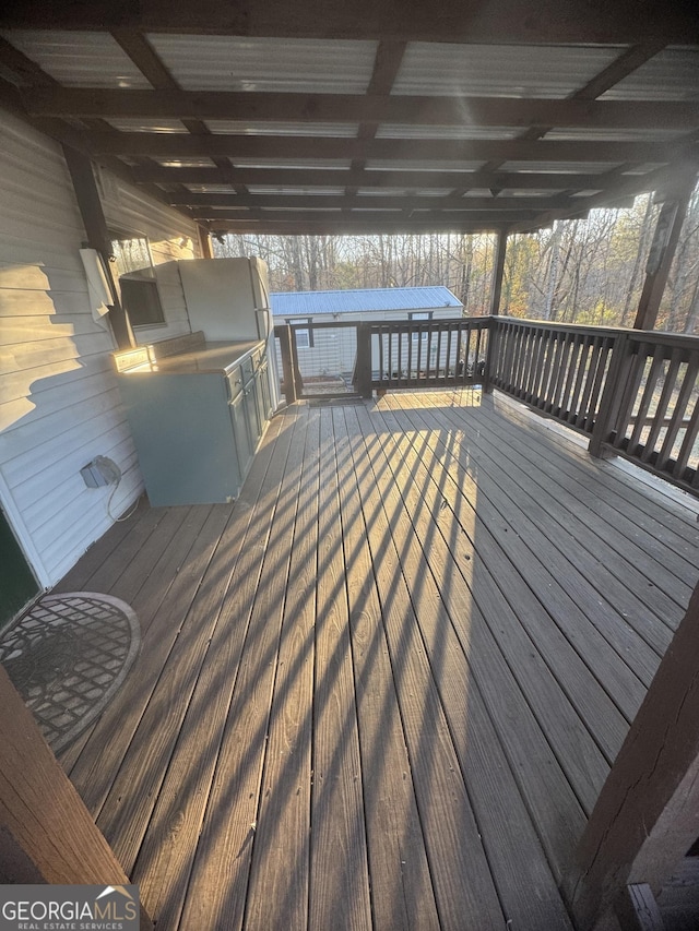 wooden deck featuring exterior kitchen