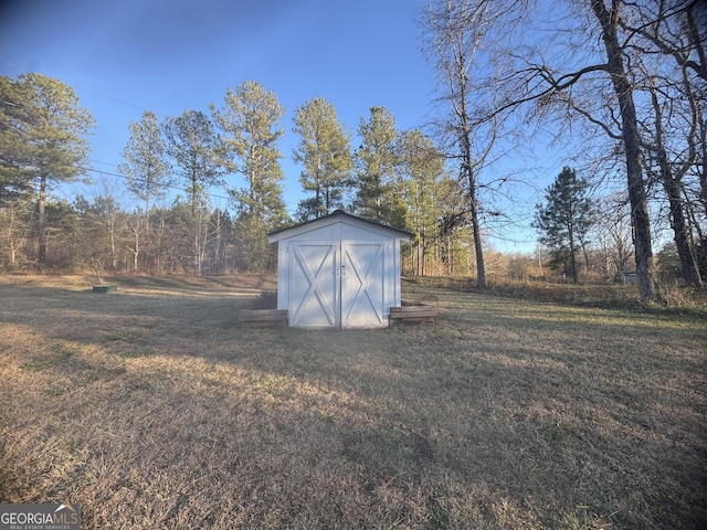 view of outbuilding with a yard