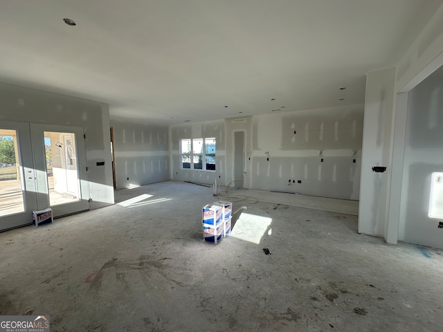 unfurnished living room with french doors