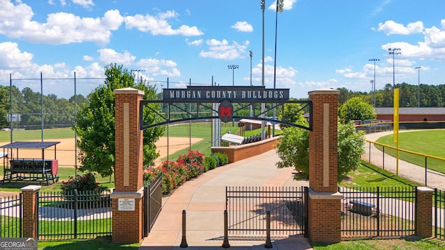 view of community featuring fence