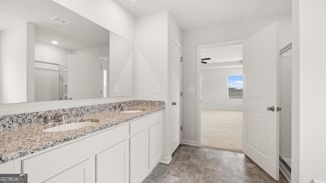 bathroom featuring ceiling fan and vanity