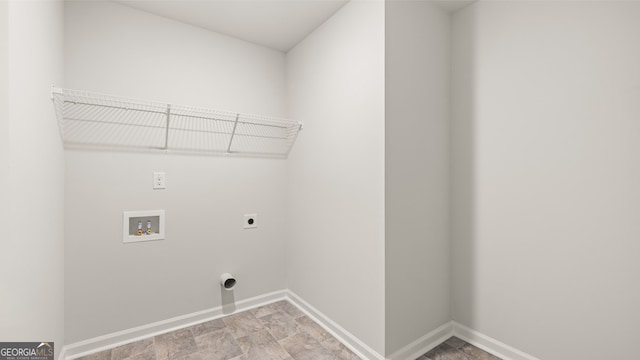 laundry room with electric dryer hookup and washer hookup