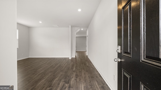 foyer with dark hardwood / wood-style floors