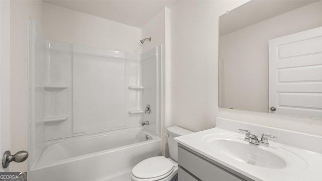 bathroom with toilet, vanity, and shower / tub combination
