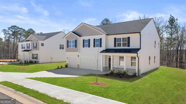 view of front of property featuring a garage, a front yard, and concrete driveway