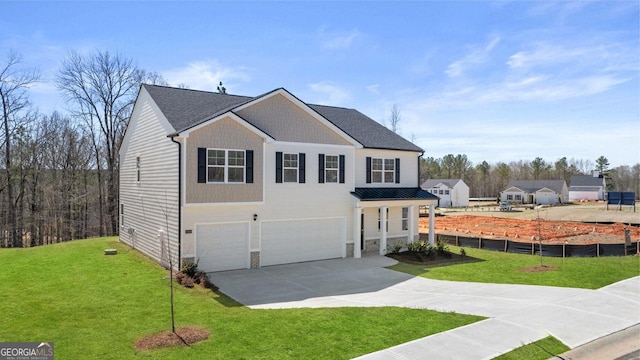 traditional-style home with an attached garage, stone siding, a front lawn, and concrete driveway