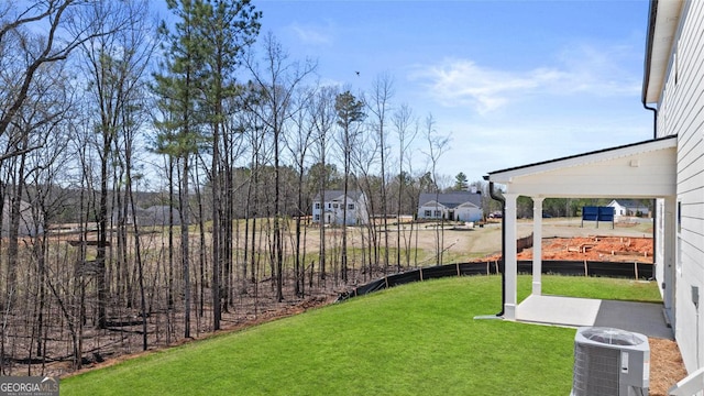 view of yard featuring central AC unit