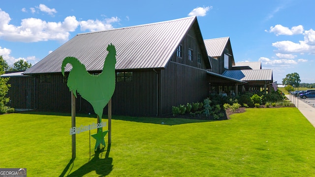 view of side of home with a lawn