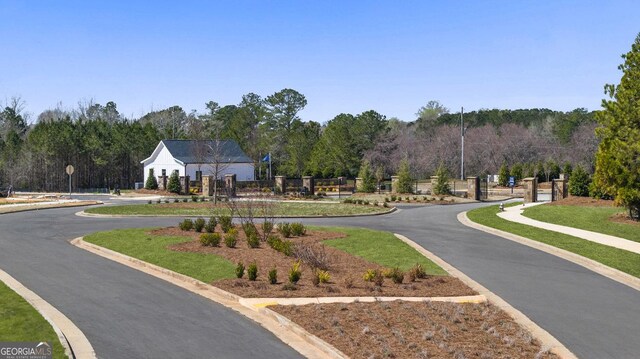 view of community featuring fence