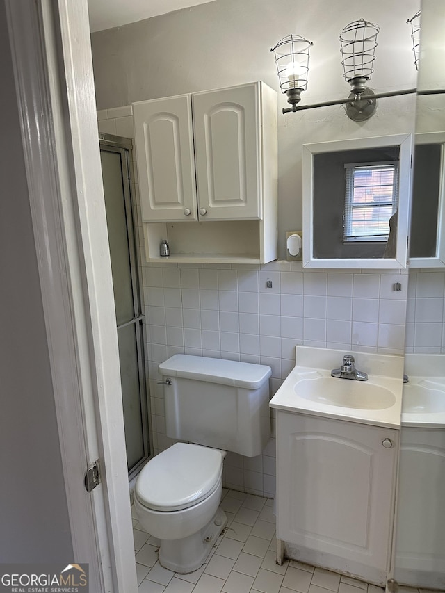 50 Pine Valley Dr, Athens, GA 30606 - bathroom featuring tile patterned flooring, vanity, tile walls, toilet, and a shower stall