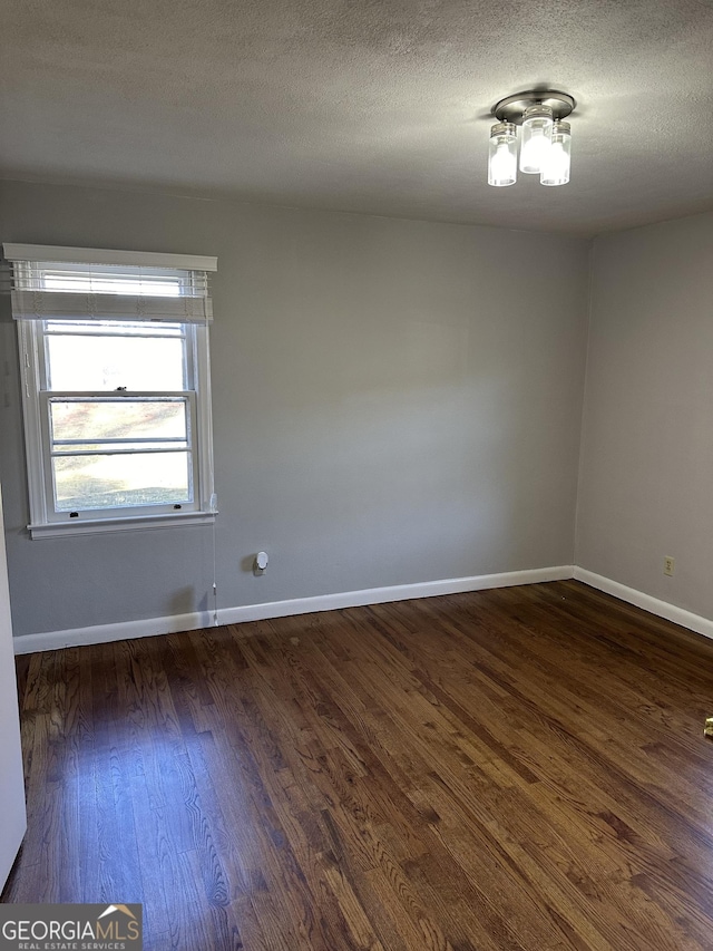 50 Pine Valley Dr, Athens, GA 30606 - unfurnished room featuring baseboards, a textured ceiling, and dark wood-style floors