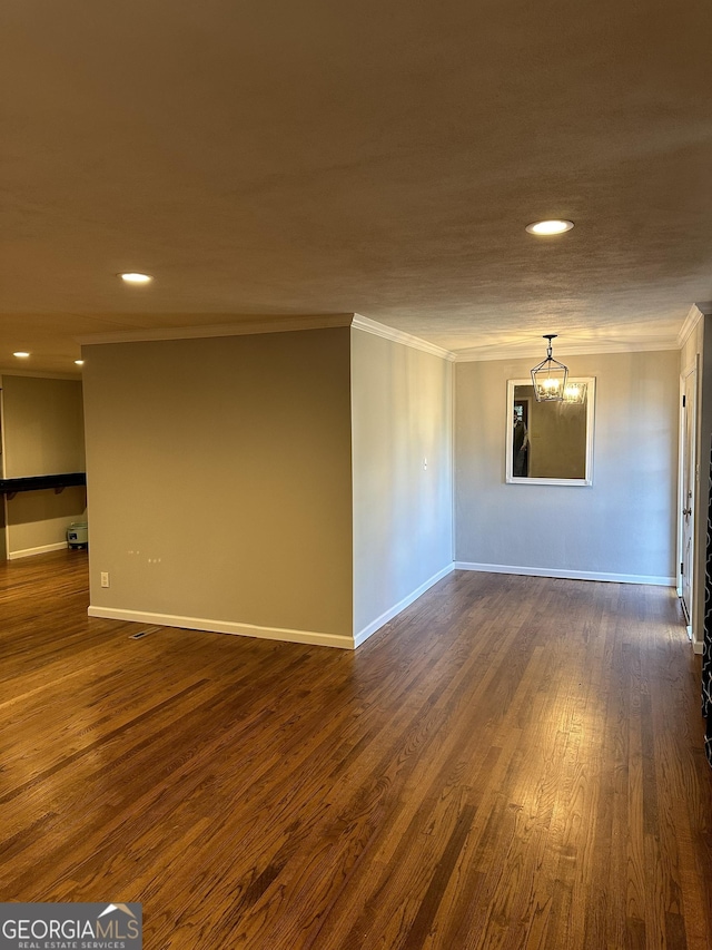 50 Pine Valley Dr, Athens, GA 30606 - spare room with dark wood-style flooring, baseboards, ornamental molding, recessed lighting, and a notable chandelier
