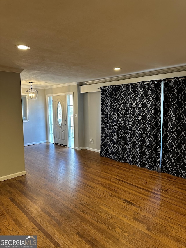 50 Pine Valley Dr, Athens, GA 30606 - interior space featuring baseboards, dark wood-style flooring, ornamental molding, and an inviting chandelier