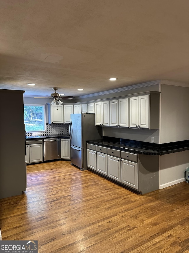 50 Pine Valley Dr, Athens, GA 30606 - kitchen featuring ornamental molding, dark countertops, stainless steel appliances, and wood finished floors
