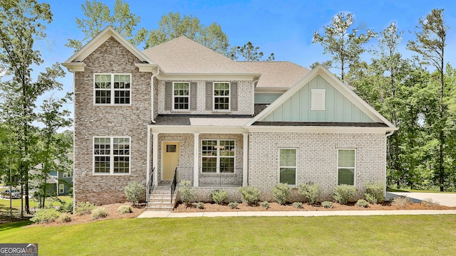 craftsman-style home with a front yard