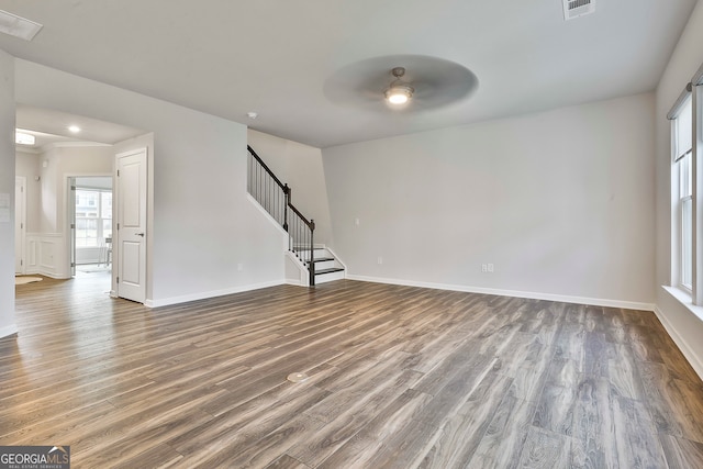 unfurnished room with hardwood / wood-style floors and ceiling fan