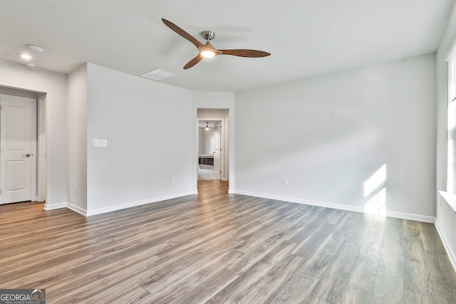 spare room with ceiling fan and hardwood / wood-style floors