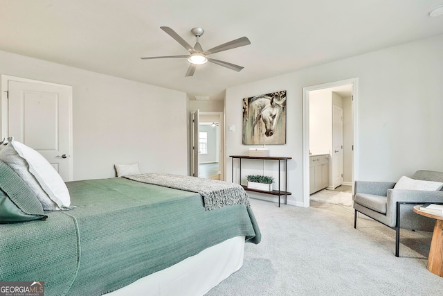 carpeted bedroom featuring connected bathroom and ceiling fan