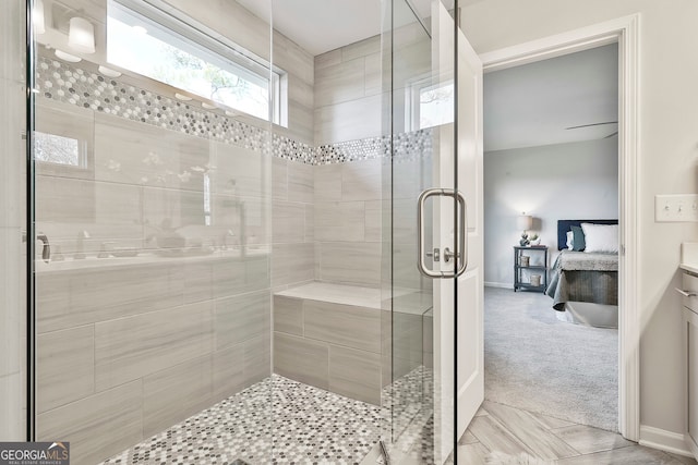 bathroom featuring vanity and a shower with shower door